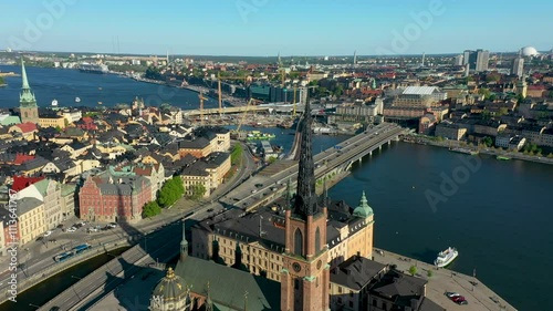 Camera panning over stockholm city center with riddarholmen church