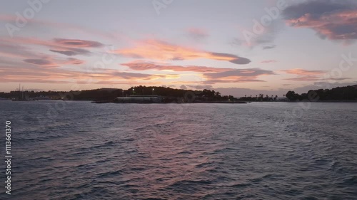 Reveal of Vouliagmeni during a colorful dusk