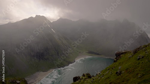 Slow motion mountains with fog and beach waves