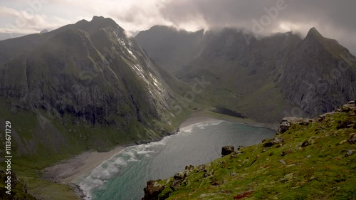 Slow motion mountains and fog with beach waves