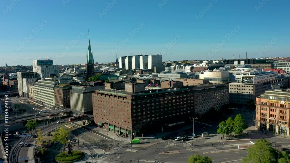 Camera panning over stockholm city center with traffic flowing on bridges