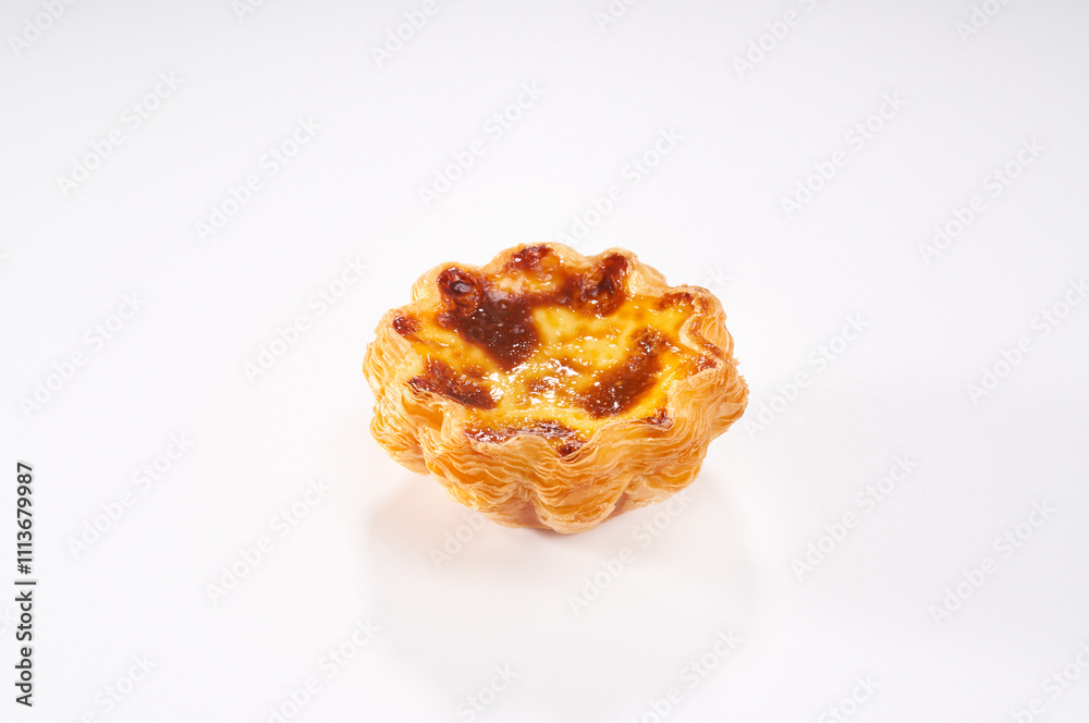 Close-up of the crispy and rich Portuguese egg tart Close-up of the crispy and rich Portuguese egg tart