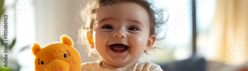 A baby holding a plushy, animalshaped rattle photo