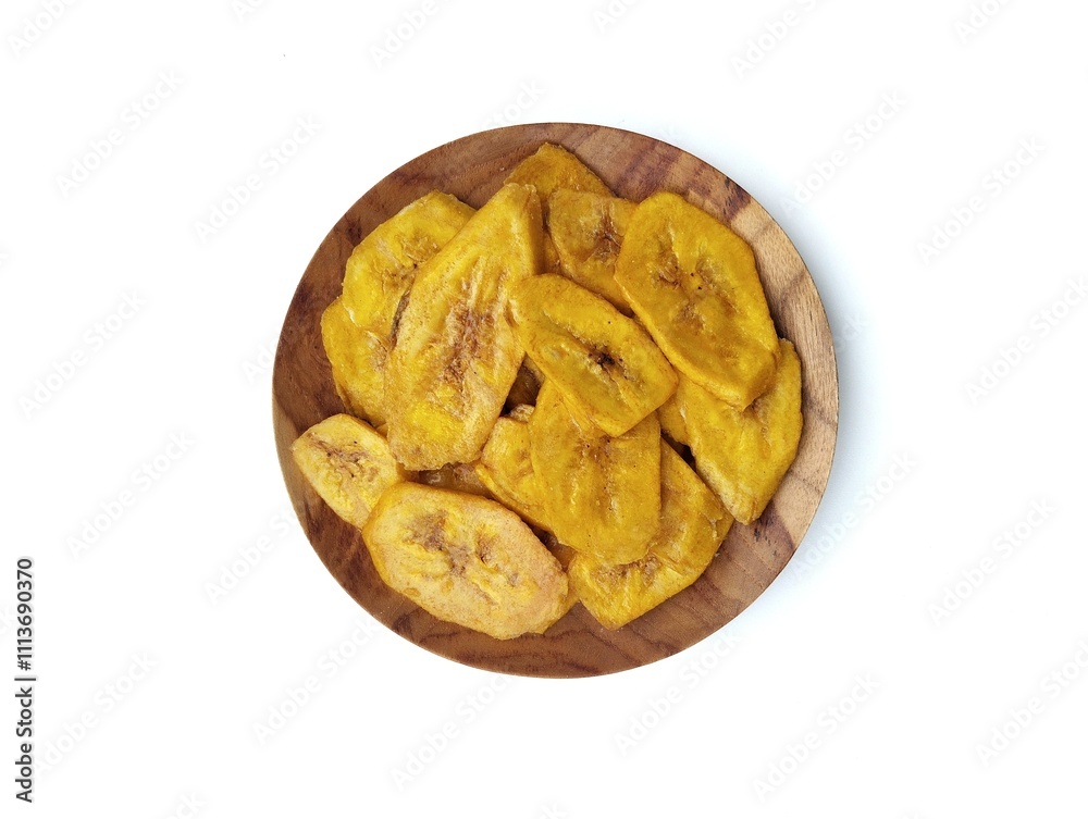 Keripik pisang or sweet banana chips on plate isolated on white background with top view angle setup, Indonesian traditional foods Keripik pisang or sweet banana chips on plate isolated on white background with top view angle setup, Indonesian traditional foods