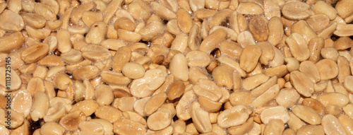 Roasted salted peanuts.Peanuts in butter.Nuts are peanuts background.The texture of roasted peanuts.