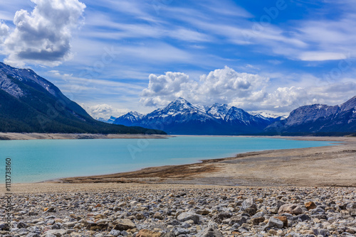 A beautiful mountain range with a lake in the foreground photo