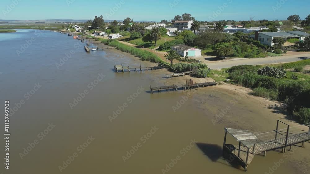 Fly along Bokkomlaan in Velddrif with riverside jetties, houses on South Africa's West Coast Fly along Bokkomlaan in Velddrif with riverside jetties, houses on South Africa's West Coast