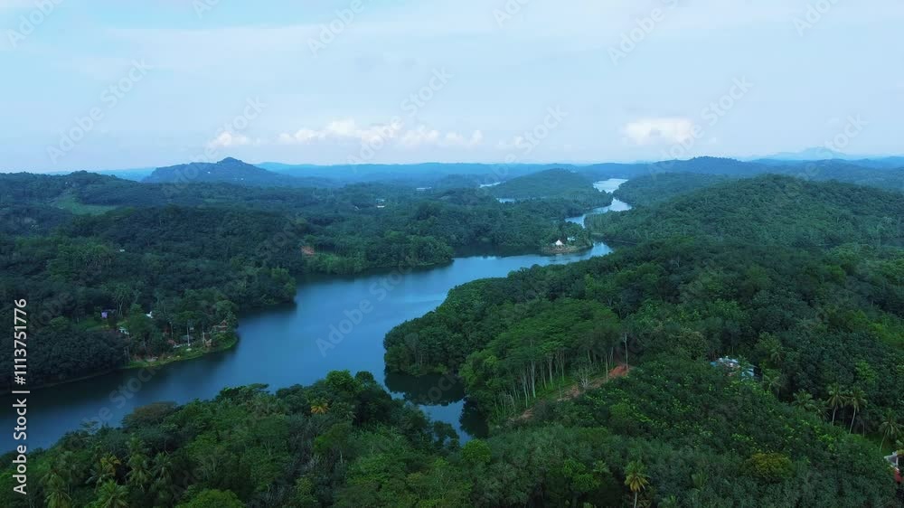 Natural dam,Areal view of a Beautiful reservoir dam in Kerala, India, Morning view of Neyyar dam, Mountains and small green islands are seen in this video Natural dam,Areal view of a Beautiful reservoir dam in Kerala, India, Morning view of Neyyar dam, Mountains and small green islands are seen in this video