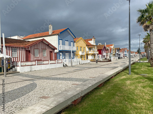 Colorful facades of houses along the streets of Costa Nova, Aveiro, showcasing the vibrant and picturesque architecture