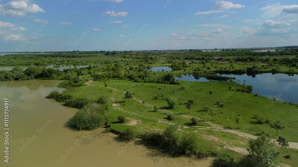 Aerial view with a delta, an ecosystem full of lakes and green willows. Amazing wild landscape seen from drone in the summer on a sunny day 4k Aerial view with a delta, an ecosystem full of lakes and green willows. Amazing wild landscape seen from drone in the summer on a sunny day 4k