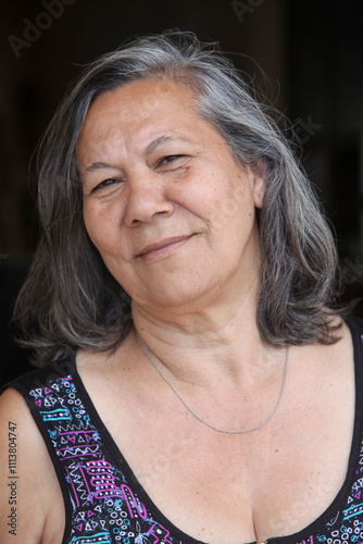 closeup portrait of cheerful elderly latino woman  photo