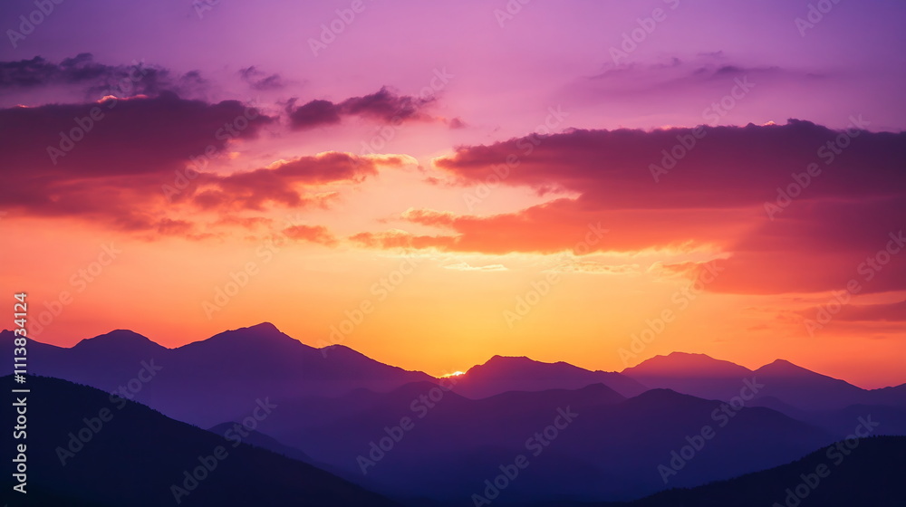 Silhouetted mountains against a deep orange and purple sunset, with clouds gently moving across the colorful sky Valentine's day horizontal web banner, sale flyer, advert, greeting card Silhouetted mountains against a deep orange and purple sunset, with clouds gently moving across the colorful sky Valentine's day horizontal web banner, sale flyer, advert, greeting card