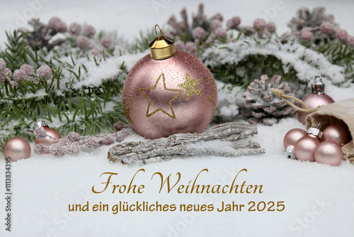 Weihnachtskarte mit Neujahrsgruß: Weihnachtskugeln mit  Tannenzweigen im Schnee mit dem Text Frohe Weihnachten und einen gutes neues Jahr 2025. photo