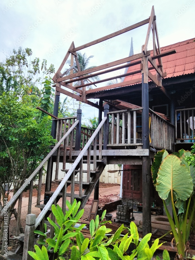 traditional Thai house is renovating roof made from wood. traditional Thai house is renovating roof made from wood.