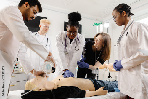 Medical personnel demonstrating cpr on dummy