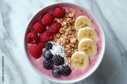 Healthy smoothie bowl features berries, banana, and granola