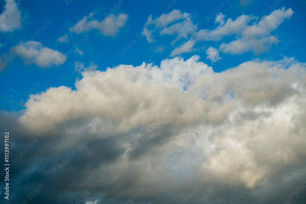 Cumulus clouds scattered across a blue sky. Cumulus clouds scattered across a blue sky.