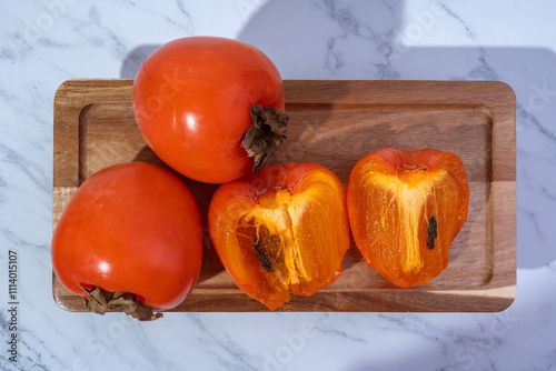 Persimmons are sweet and juicy fruits.