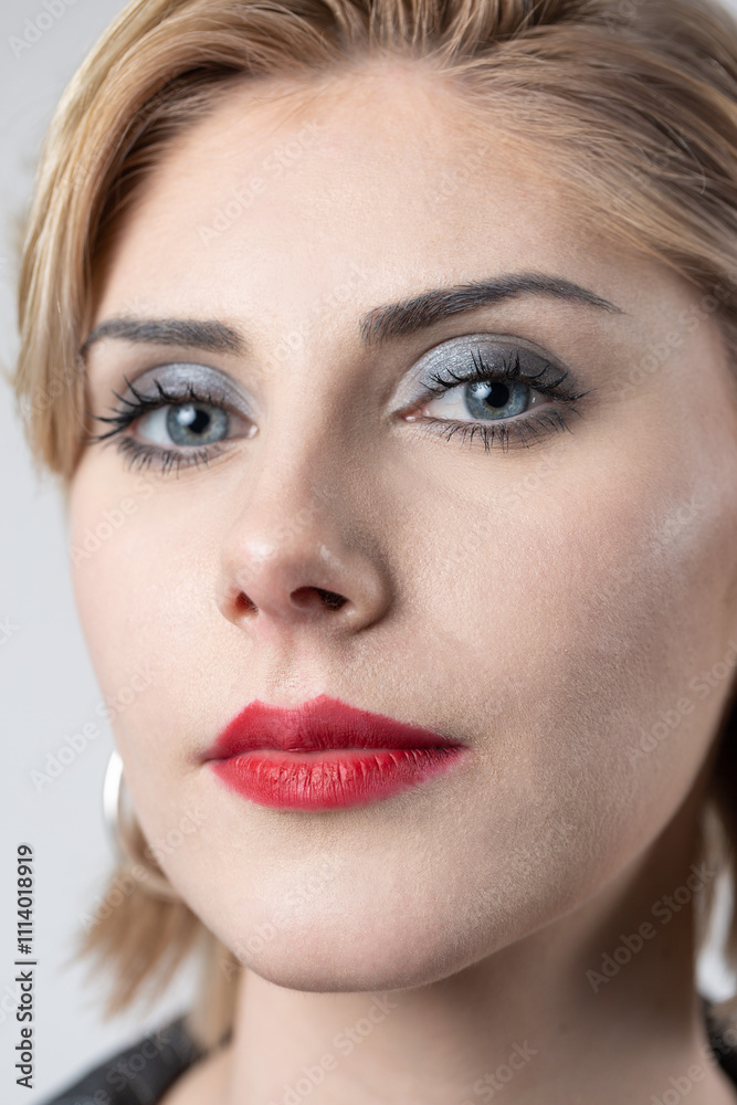 Portrait of a seductive, stylish business lady in the studio. Blonde girl in a suit and top. Portrait of a seductive, stylish business lady in the studio. Blonde girl in a suit and top.