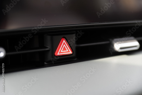 Closeup view of an emergency light button in a car