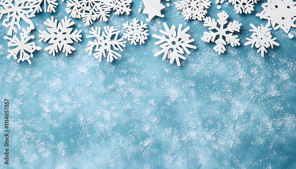 Festive winter background featuring paper snowflakes arranged on a textured blue surface, reminiscent of snow. Ideal for holiday cards or winter-themed designs. Festive winter background featuring paper snowflakes arranged on a textured blue surface, reminiscent of snow. Ideal for holiday cards or winter-themed designs.