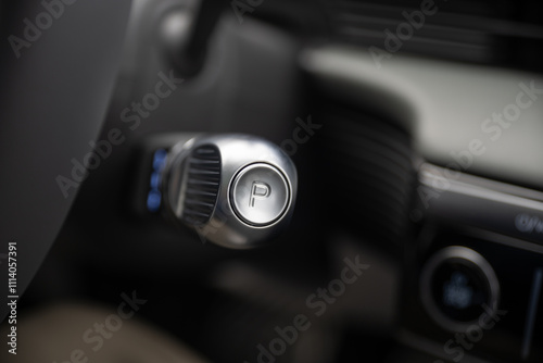 Closeup view of a park mode button on an electric vehicle