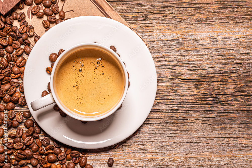 A cup of aromatic coffee on a wooden table.