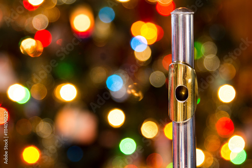 a flute with a christmas tree in the background photo