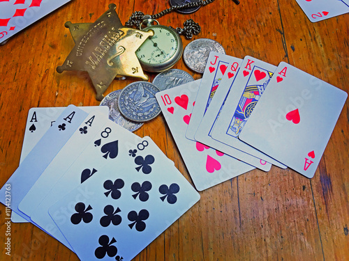  Dead man's hand . Aces and two Eights, named after Wild Bill Hickok who was killed with it in 1876.also in the images is a Royal flush of hearts.Deadwood, Dakota Territory, USA photo