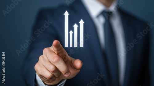 A businessman points to a digital graph indicating upward growth, symbolizing success and progress in a professional setting.