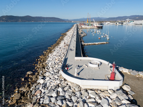 Aerial view of the new waterfront built on the breakwater of the commercial port of Marina di Carrara, in Tuscany