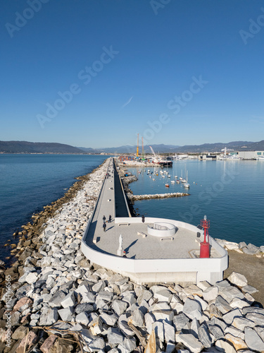 Aerial view of the new waterfront built on the breakwater of the commercial port of Marina di Carrara, in Tuscany