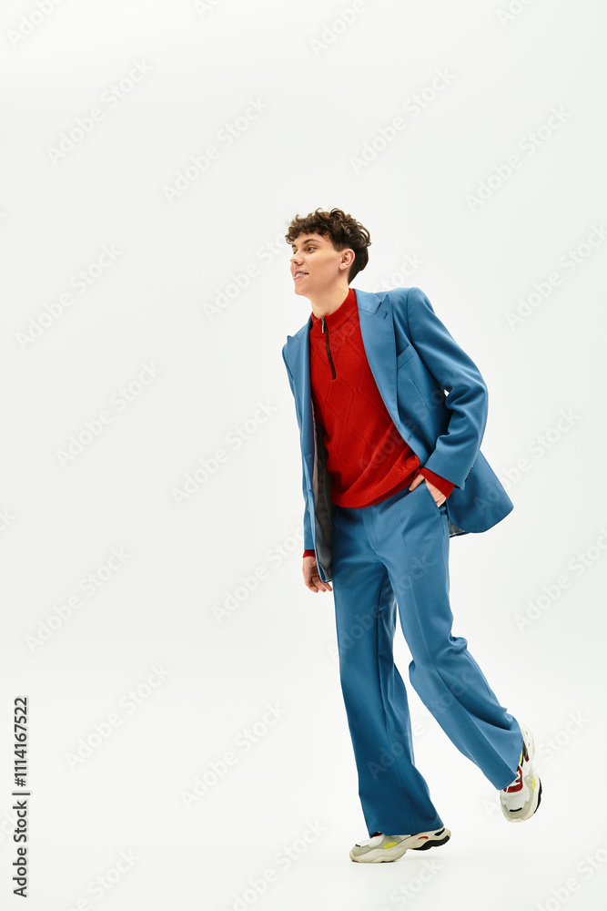 A stylish man in a vivid blue suit strolls confidently, highlighting modern fashion.