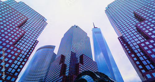 City skyline with a large building in the middle and two smaller buildings on either side. The sky is cloudy and the buildings are tall. New York city, Manhattan.