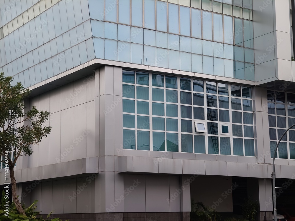 The beauty of the exterior design of modern campus and office buildings made of aesthetic metal or glass The beauty of the exterior design of modern campus and office buildings made of aesthetic metal or glass