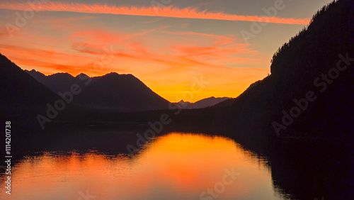 Sunset at Lake Sylvenstein in the Alpine foothills on an autumn evening photo