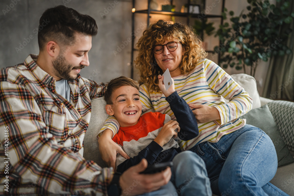 mum, dad and son shop online on mobile phone and have fun together mum, dad and son shop online on mobile phone and have fun together