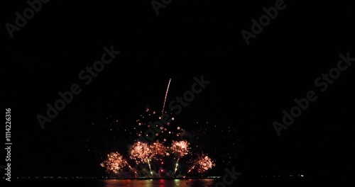 Celebration greeting Beautiful fireworks colorful fireworks on the beach for abstract background , anniversary, celebration , 4th independence day and new year background or wallpaper.