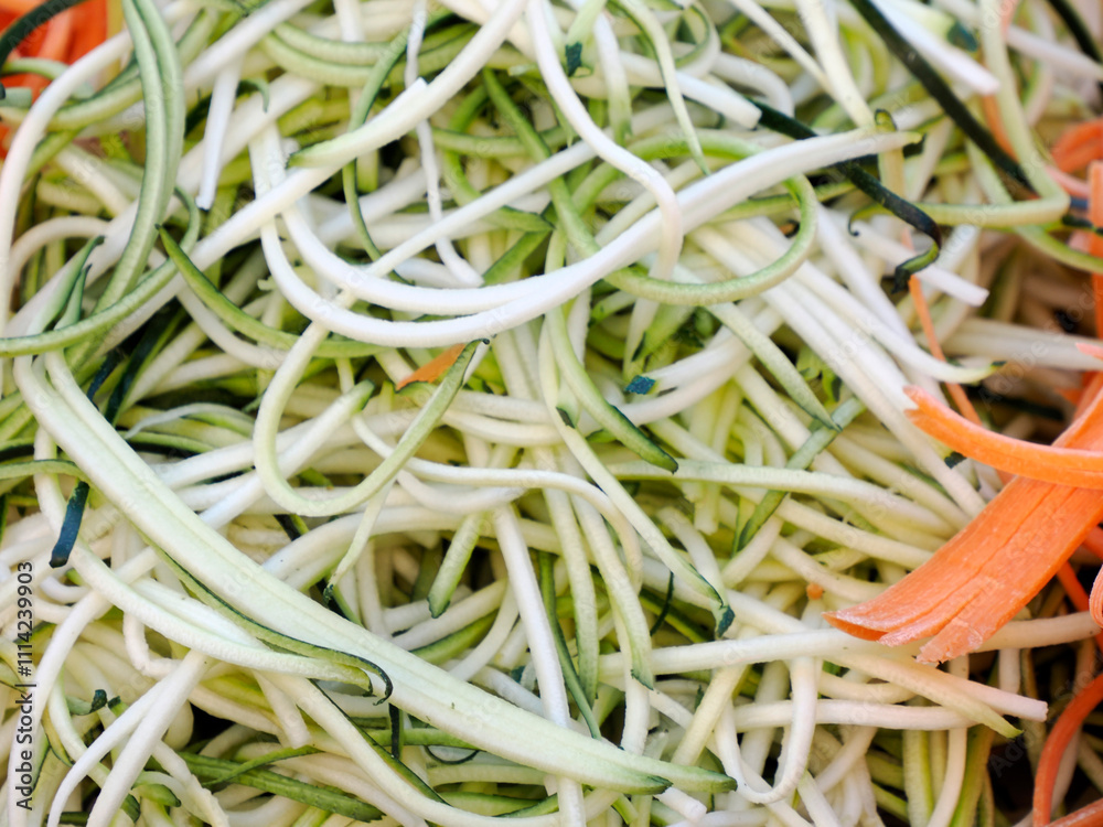 Green zucchini spaghetti noodles detail Green zucchini spaghetti noodles detail