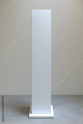 Tall white blank rectangular pedestal isolated on grey background.