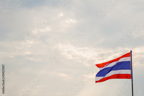 Quadro su tela Motion and blur, the Thai flag fluttering atop the flagpole represents the Thai nation that knows love and unity