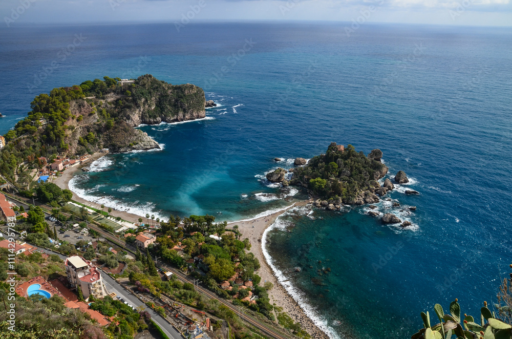 Fototapeta premium View of the Ionian Sea and the island of Isola Bella from the viewpoints in Taormina, Sicily 