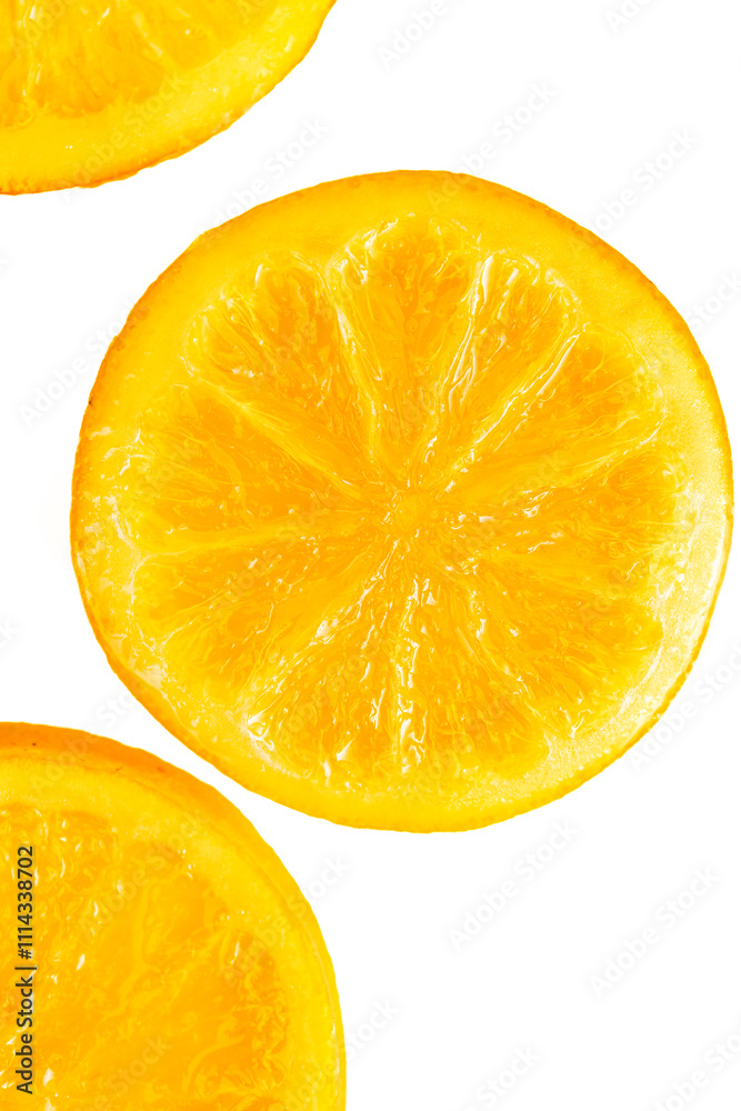 Close-Up of Candied Orange Slices on a White Ceramic Plate Close-Up of Candied Orange Slices on a White Ceramic Plate