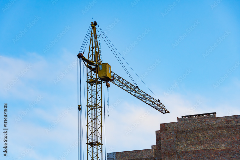 Two cranes are actively engaged at a large construction site, lifting materials high above the ground. This urban development project showcases industrial activity in a bustling skyline Two cranes are actively engaged at a large construction site, lifting materials high above the ground. This urban development project showcases industrial activity in a bustling skyline