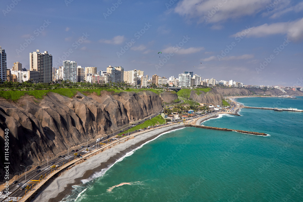 Obraz premium Soaring above La Costa Verde. From this height, you can truly appreciate the stunning blend of ocean blues, rugged cliffs, and city energy that make Miraflores unforgettable. 
