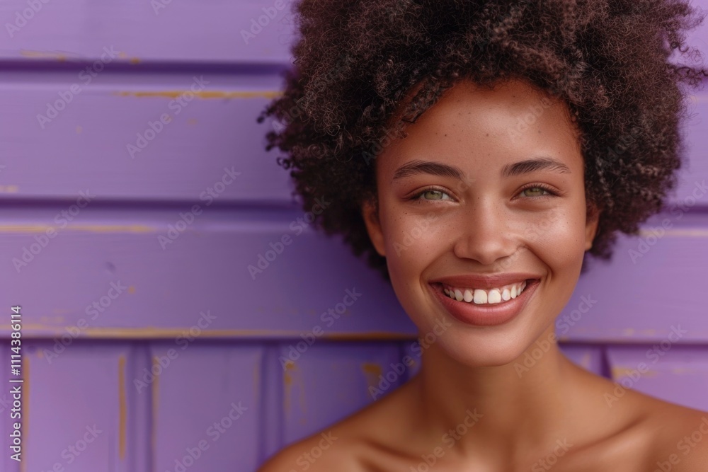 A person with curly hair smiling directly at the camera, a friendly and approachable expression A person with curly hair smiling directly at the camera, a friendly and approachable expression