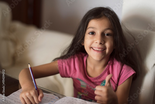 little girl doing homewrok at home