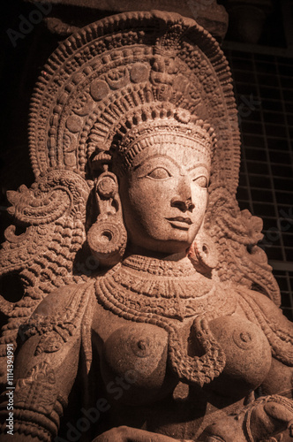 Carved sculpture of Hindu god and goddess at Meenakshi temple, Madurai, Tamil Nadu, India.