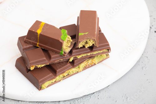 Dubai chocolate with green kataifi and pistachio paste. Trend dessert photo