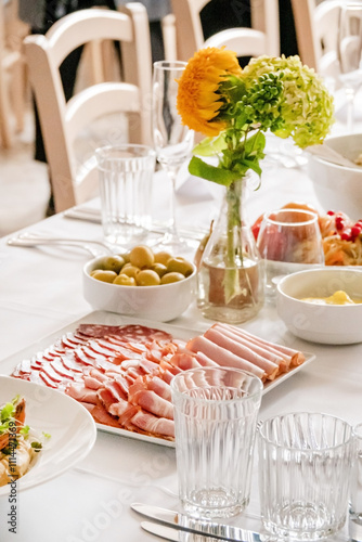 The wedding table set covered with different dishes photo